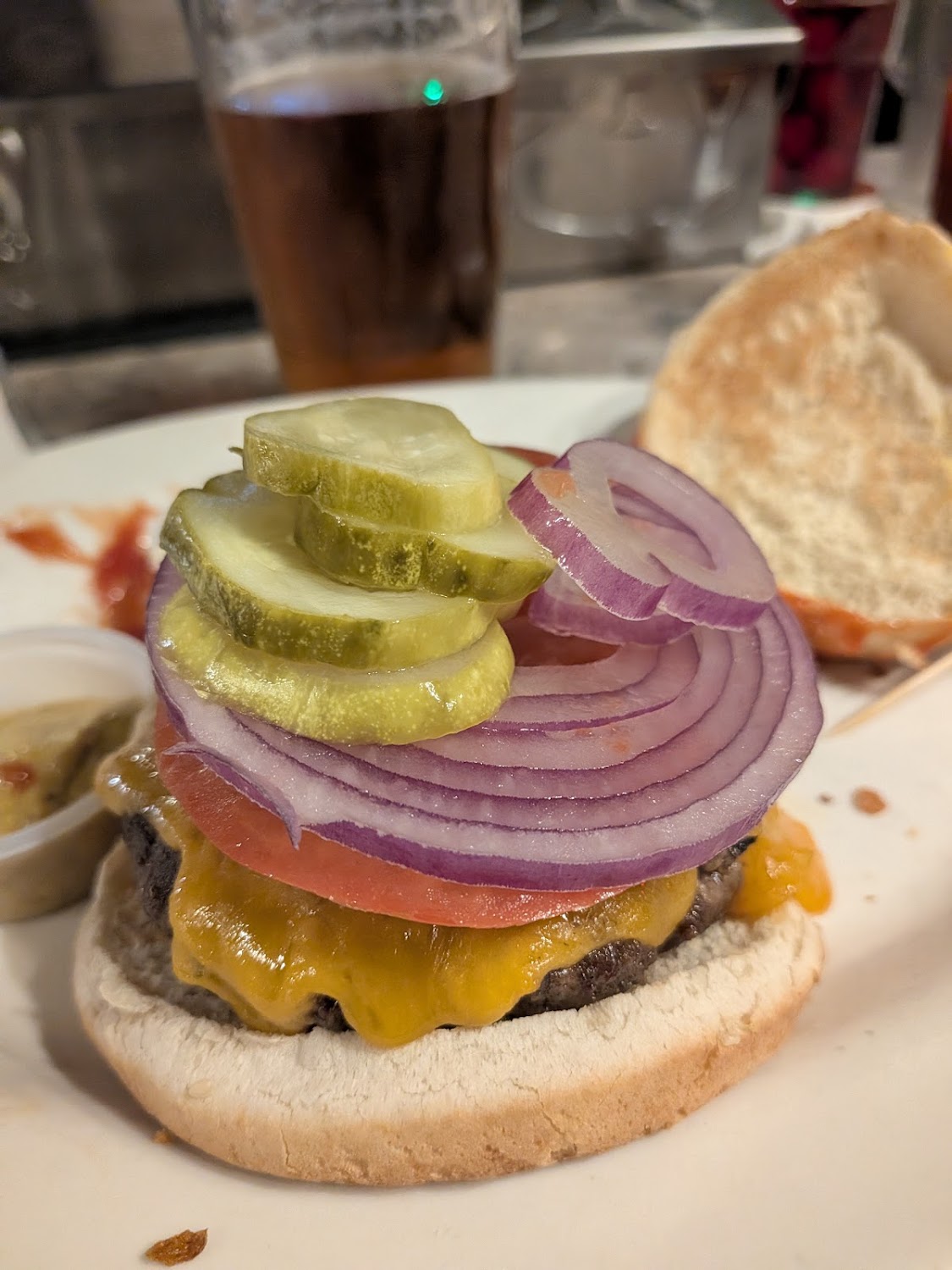 The classic Old Town cheeseburger with a pint